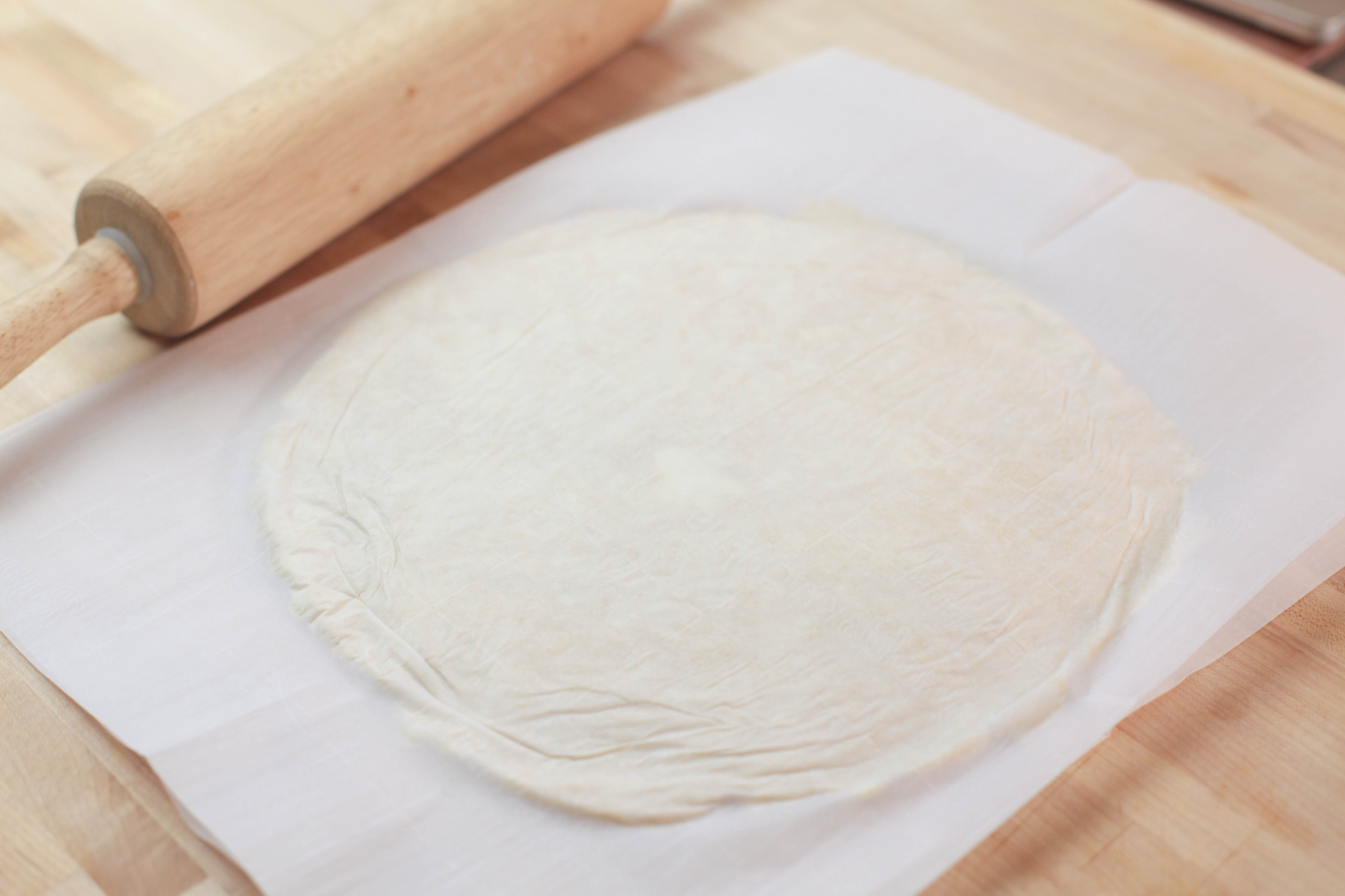 dough pressed into 10 inch circle